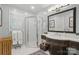 Well-lit bathroom with walk-in shower, modern vanity, and elegant fixtures at 13916 & 13912 Sledge Rd, Charlotte, NC 28278