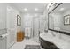 Bright bathroom with walk-in shower, white tile, and modern vanity at 13916 & 13912 Sledge Rd, Charlotte, NC 28278