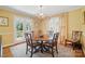 Bright dining room with French doors and large window, featuring a chandelier and dining table at 13916 & 13912 Sledge Rd, Charlotte, NC 28278