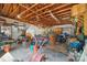 Spacious garage with exposed wood beams and ample storage space, perfect for projects and organization at 13916 & 13912 Sledge Rd, Charlotte, NC 28278