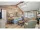 Charming living room with vaulted ceilings, wood accent wall, and bright lighting at 13916 & 13912 Sledge Rd, Charlotte, NC 28278