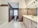 Nicely decorated bathroom with white cabinets and a large mirror over double sinks at 15618 Eagleview Dr, Charlotte, NC 28278
