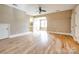 Bright bedroom with hardwood floors, ceiling fan, and ensuite bathroom entrance at 15618 Eagleview Dr, Charlotte, NC 28278