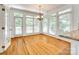 Bright breakfast nook with multiple windows and a French door, offering a sunny and airy atmosphere at 15618 Eagleview Dr, Charlotte, NC 28278