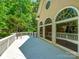 Wide wooden deck overlooking treeline at 15618 Eagleview Dr, Charlotte, NC 28278