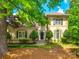 Charming exterior of a traditional home with manicured lawn and mature trees on a sunny day at 15618 Eagleview Dr, Charlotte, NC 28278
