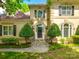 Inviting home exterior with a well-maintained lawn, manicured shrubbery, and a welcoming entrance at 15618 Eagleview Dr, Charlotte, NC 28278