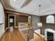 Grand foyer with wood floors, staircase, chandelier, and lots of natural light at 15618 Eagleview Dr, Charlotte, NC 28278