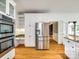 Modern kitchen boasts built-in stainless appliances and lots of white cabinet space at 15618 Eagleview Dr, Charlotte, NC 28278