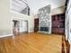Inviting living room with hardwood floors, a cozy fireplace, and an open layout with natural light at 15618 Eagleview Dr, Charlotte, NC 28278