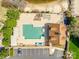 Aerial view of a community pool with lounge chairs, parking, and lots of trees at 15618 Eagleview Dr, Charlotte, NC 28278