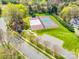 Aerial view showcases the well-maintained tennis and basketball courts, offering residents great recreational opportunities at 15618 Eagleview Dr, Charlotte, NC 28278