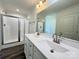 Modern bathroom featuring a double sink vanity with a glass-enclosed shower at 159 Hallman St, Cherryville, NC 28021