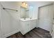 Bright bathroom with a white double vanity, wood-look flooring, and neutral wall paint at 159 Hallman St, Cherryville, NC 28021