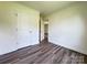 Stylish bedroom with modern wood-look floors and bright white doors at 159 Hallman St, Cherryville, NC 28021