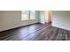 Comfortable bedroom with wood-look flooring and natural light at 159 Hallman St, Cherryville, NC 28021