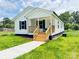 Charming single-story home with a welcoming front porch and well-maintained lawn at 159 Hallman St, Cherryville, NC 28021
