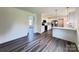 Open-concept kitchen with white cabinets, stainless steel appliances, and breakfast bar at 159 Hallman St, Cherryville, NC 28021