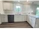 Bright kitchen with stainless steel dishwasher, white cabinets, and quartz countertops at 159 Hallman St, Cherryville, NC 28021