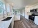 Well-appointed kitchen boasting stainless appliances, quartz countertops, and ample cabinet space at 159 Hallman St, Cherryville, NC 28021
