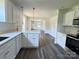 Bright and airy kitchen featuring modern cabinets and stainless steel appliances at 159 Hallman St, Cherryville, NC 28021