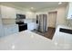 Modern kitchen featuring white cabinets, quartz countertops, and stainless steel appliances at 159 Hallman St, Cherryville, NC 28021