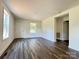 Inviting living room featuring hardwood floors, neutral paint, and bright windows at 159 Hallman St, Cherryville, NC 28021