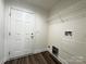 Practical utility room featuring a door to the outside and laundry hookups at 159 Hallman St, Cherryville, NC 28021