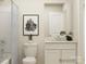 Clean bathroom featuring a shower-tub combination with stylish fixtures, a white vanity, and minimalist decor at 1613 Spring Lot Dr, Edgemoor, SC 29712