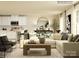 Open-concept living area with a comfortable sofa, a wooden coffee table, and views of the modern kitchen at 1613 Spring Lot Dr, Edgemoor, SC 29712
