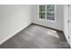 Bedroom with neutral walls, carpet, and a bright window offering natural light at 1625 Winthrop Ln, Monroe, NC 28110