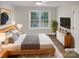 Cozy bedroom featuring a large window, stylish furnishings, and a comfortable atmosphere at 1625 Winthrop Ln, Monroe, NC 28110