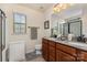 Bathroom featuring double sinks, granite counters, and a shower/tub combo at 1720 Fleetwood Dr, Charlotte, NC 28208