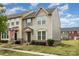Townhome with charming curb appeal, featuring well-maintained landscaping at 1720 Fleetwood Dr, Charlotte, NC 28208
