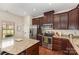 Well-equipped kitchen with stainless appliances, granite counters, and cherry cabinets at 1720 Fleetwood Dr, Charlotte, NC 28208