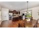 Open concept kitchen with stainless steel appliances and an island with seating at 1720 Fleetwood Dr, Charlotte, NC 28208