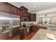 Bright kitchen featuring stainless steel appliances, granite counters, and hardwood floors at 1720 Fleetwood Dr, Charlotte, NC 28208
