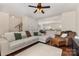 Open living room featuring hardwood floors, a ceiling fan, and comfortable seating at 1720 Fleetwood Dr, Charlotte, NC 28208