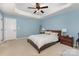 Comfortable main bedroom with neutral paint, tray ceiling, and lots of sunlight at 1720 Fleetwood Dr, Charlotte, NC 28208