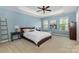 Inviting bedroom with tray ceiling, soothing paint, and natural light at 1720 Fleetwood Dr, Charlotte, NC 28208
