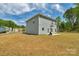 Spacious backyard with a basketball hoop, perfect for outdoor activities at 197 Park View Dr, Stanfield, NC 28163