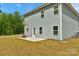 A view of a spacious backyard with a basketball hoop on a concrete pad at 197 Park View Dr, Stanfield, NC 28163