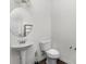 Neat half bathroom with a pedestal sink and ample space at 197 Park View Dr, Stanfield, NC 28163