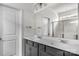 Modern bathroom features dual sinks, a large mirror, and a walk-in shower with glass doors at 197 Park View Dr, Stanfield, NC 28163