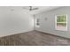Bedroom boasts natural light, vinyl floors, and a ceiling fan at 197 Park View Dr, Stanfield, NC 28163