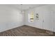 Cozy dining area showcasing wood-look flooring, wainscoting, and natural light at 197 Park View Dr, Stanfield, NC 28163