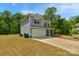 Attractive two-story home with a well-kept lawn and a practical two-car garage at 197 Park View Dr, Stanfield, NC 28163
