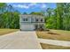 Charming two-story home featuring a well-maintained lawn and a spacious two-car garage at 197 Park View Dr, Stanfield, NC 28163