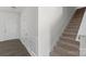 Bright hallway featuring stairs with carpet and white trim, leading to the upper level at 197 Park View Dr, Stanfield, NC 28163