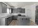 View of a modern kitchen showcasing granite countertops, a center island, and stainless steel appliances at 197 Park View Dr, Stanfield, NC 28163